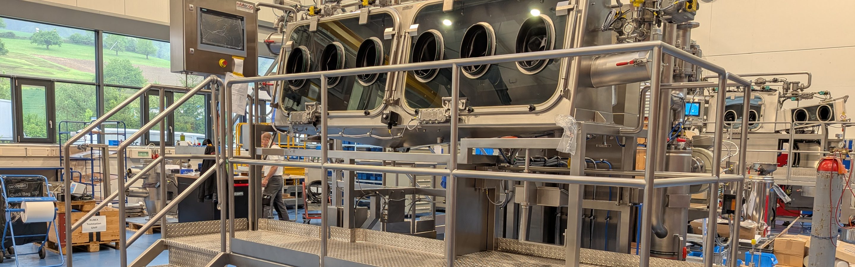 Containment isolator by rubitec ag with glove ports on a mobile operating platform at the Bennwil works